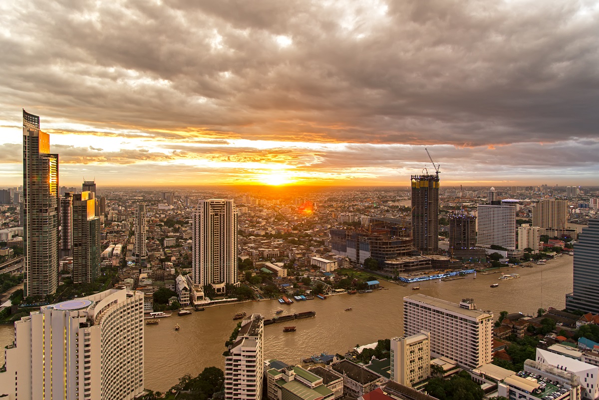 Aerial view over Bangkok modern office building in bangkok business zone near the river with sunset sky in Bangkok, Thailand