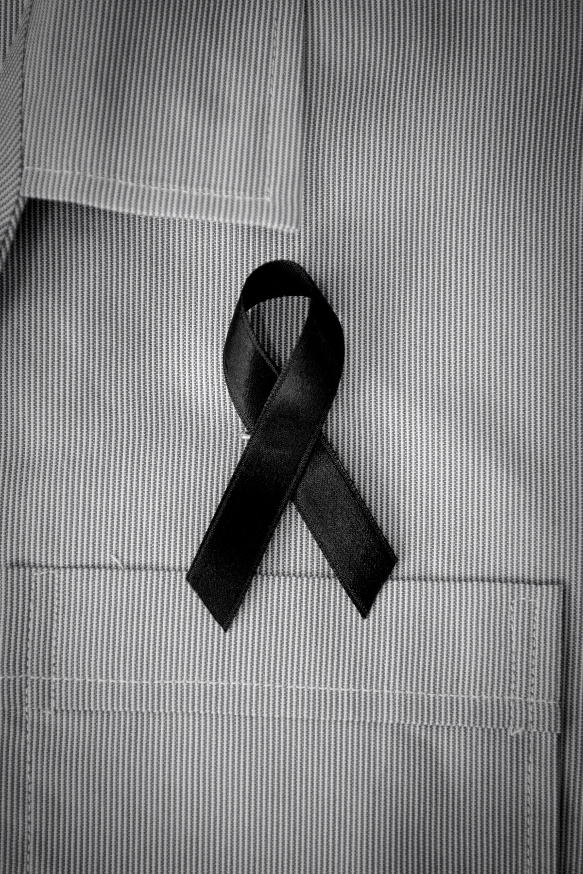 black awareness ribbon on shirt